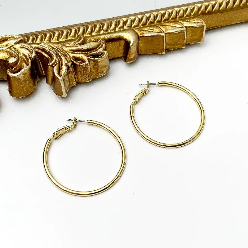 Tiny Huggie Earrings-Sorrelli | Dahlia Hoop Earrings in Bright Gold Tone