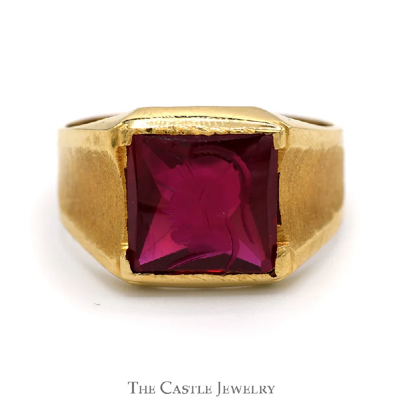 Men's Engagement Ring-Men's Synthetic Ruby Intaglio Ring with Brush Textured Sides in 18k Yellow Gold